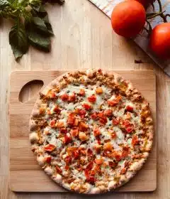 pizza on brown wooden table